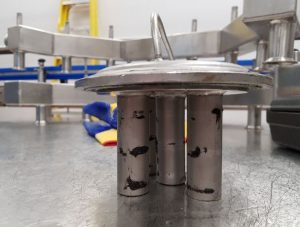 Fine iron contamination captured on Tube Magnets-Practically Measuring Magnetics Separator Strength-Bunting Magnetics